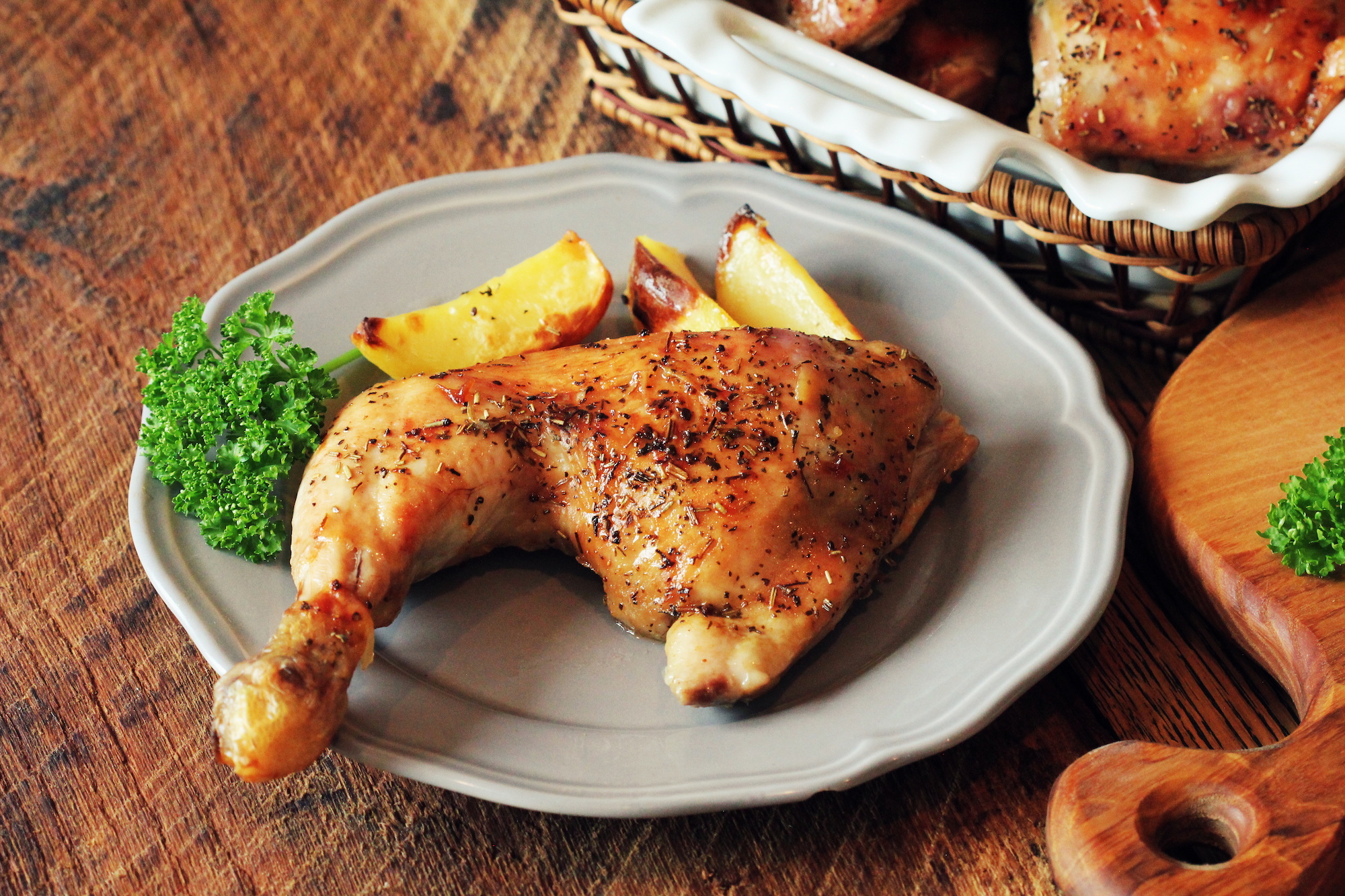Grilled chicken leg with potato for garnish